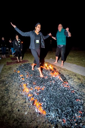 two people fire walking